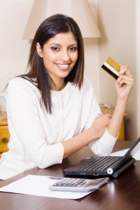 beautiful indian woman doing internet banking